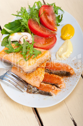 grilled samon filet with vegetables salad