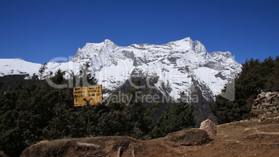 Signboard and snow capped Kongde Ri