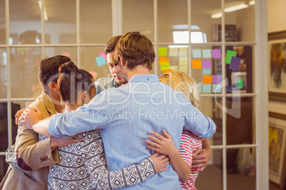 Casual business team standing in a circle