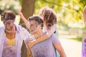 Young friends having fun with powder paint
