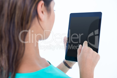 Casual brunette using tablet computer