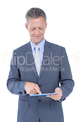 Smiling businessman against a white background