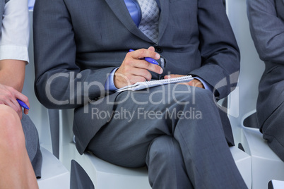 businessman taking a note during a meeting