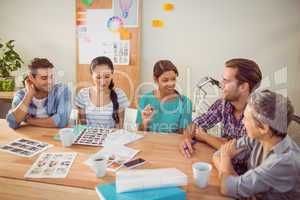 Seated creative business team working together