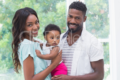 Happy parents with baby girl