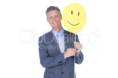 Businessman with happy smiley faced balloon