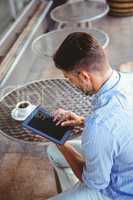 Attentive businessman using a tablet