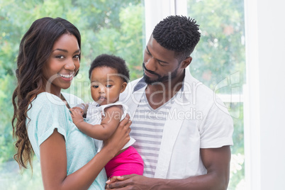 Happy parents with baby girl