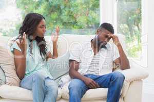 Couple having argument on the couch