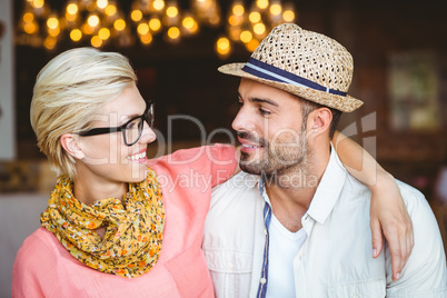 Cute couple on a date looking each other