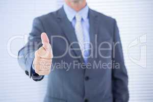 positive businessman smiling with thumb up