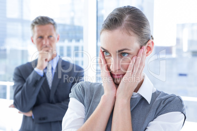 Businesswoman with hands on her face