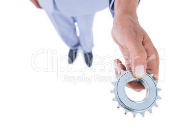 businessman holding a gear