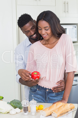 Happy couple preparing food together