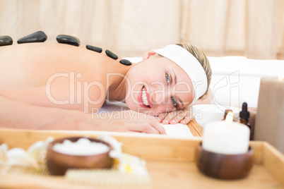 Beautiful blonde enjoying a hot stone massage