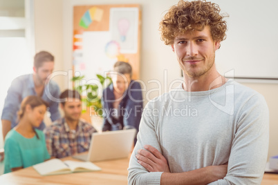 Portrait of a man with his colleague behind him