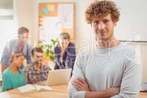 Portrait of a man with his colleague behind him