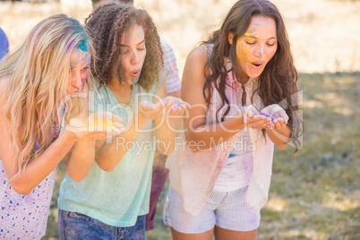 Young women having fun with powder paint