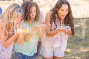 Young women having fun with powder paint