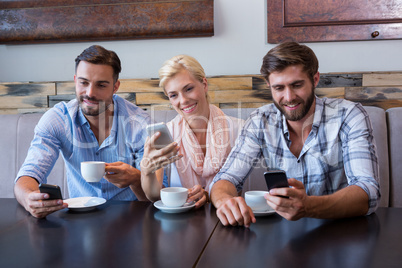 Colleagues working with smartphones