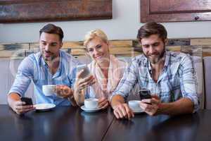 Colleagues working with smartphones