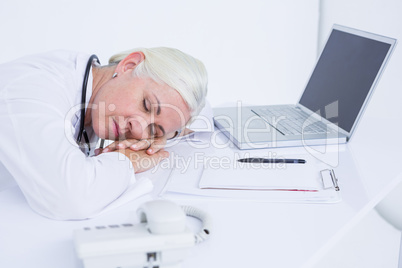 doctor sleeping on her desk