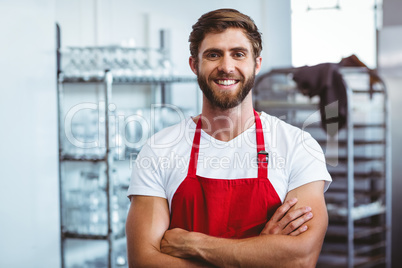 Handsome barista smiling at the camera