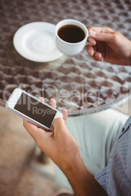 Close up view of businessman texting