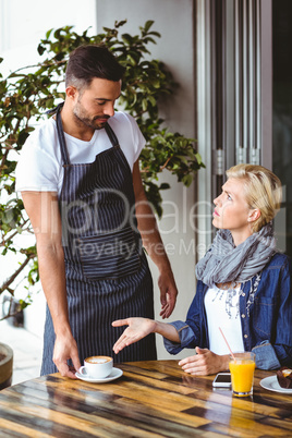 Pretty blonde arguing with the waiter