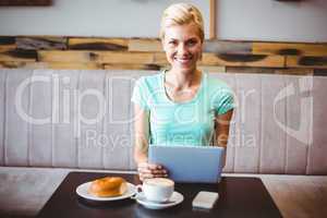 Pretty blonde using laptop computer