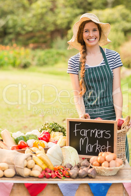 Pretty brunette standing at her stall