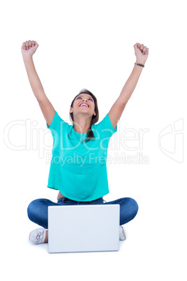 Pretty brunette cheering in front of camera