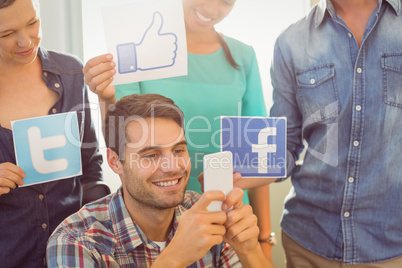 Colleagues holding sign from famous social networks