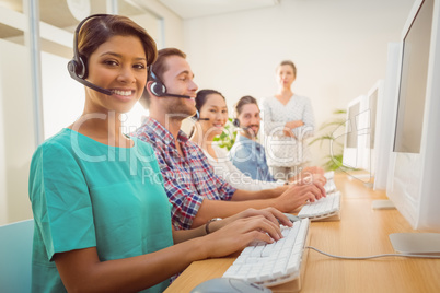 Call center agent working under a manager supervision
