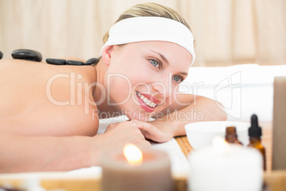 Beautiful blonde enjoying a hot stone massage