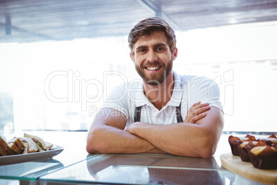 Handsome worker posing on the counter