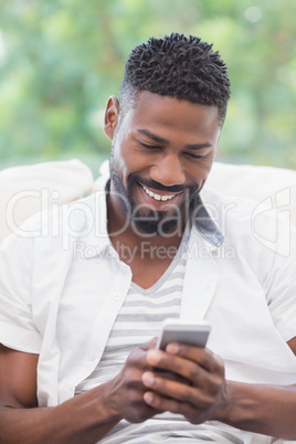 Casual man using his smartphone