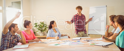 Casual businessman giving presentation to his colleagues