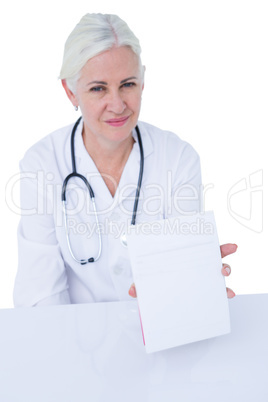 Doctor writing on a notepad