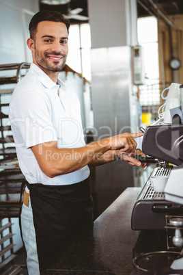 happy worker making coffee