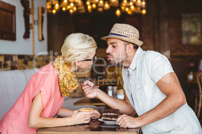 Cute couple on a date kissing each other