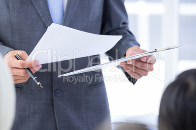 Business team taking notes during conference