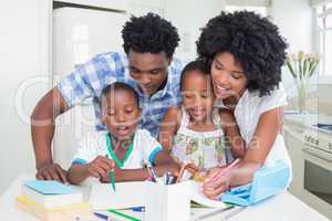 Happy parents helping children with homework