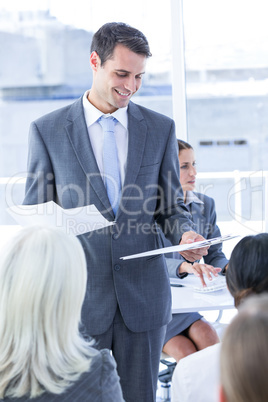 Businessman give a paper