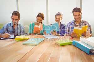 Group of colleagues reading books