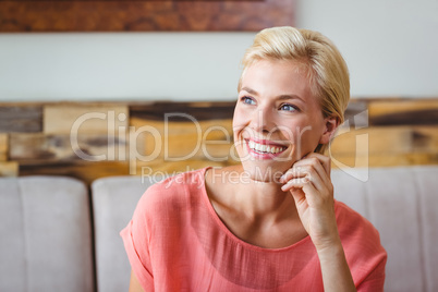 Pretty blonde holding cup of coffee