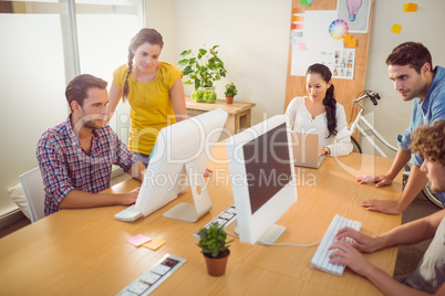 Attentive business team working on laptops