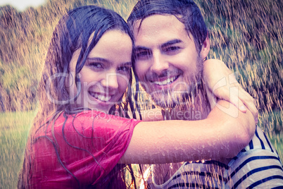 Cute couple hugging under the rain