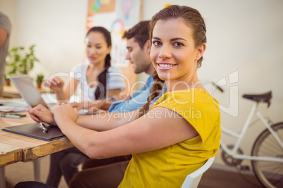 Smiling young businesswoman in a meeting