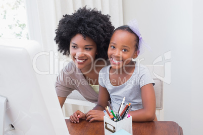 Happy family using the computer